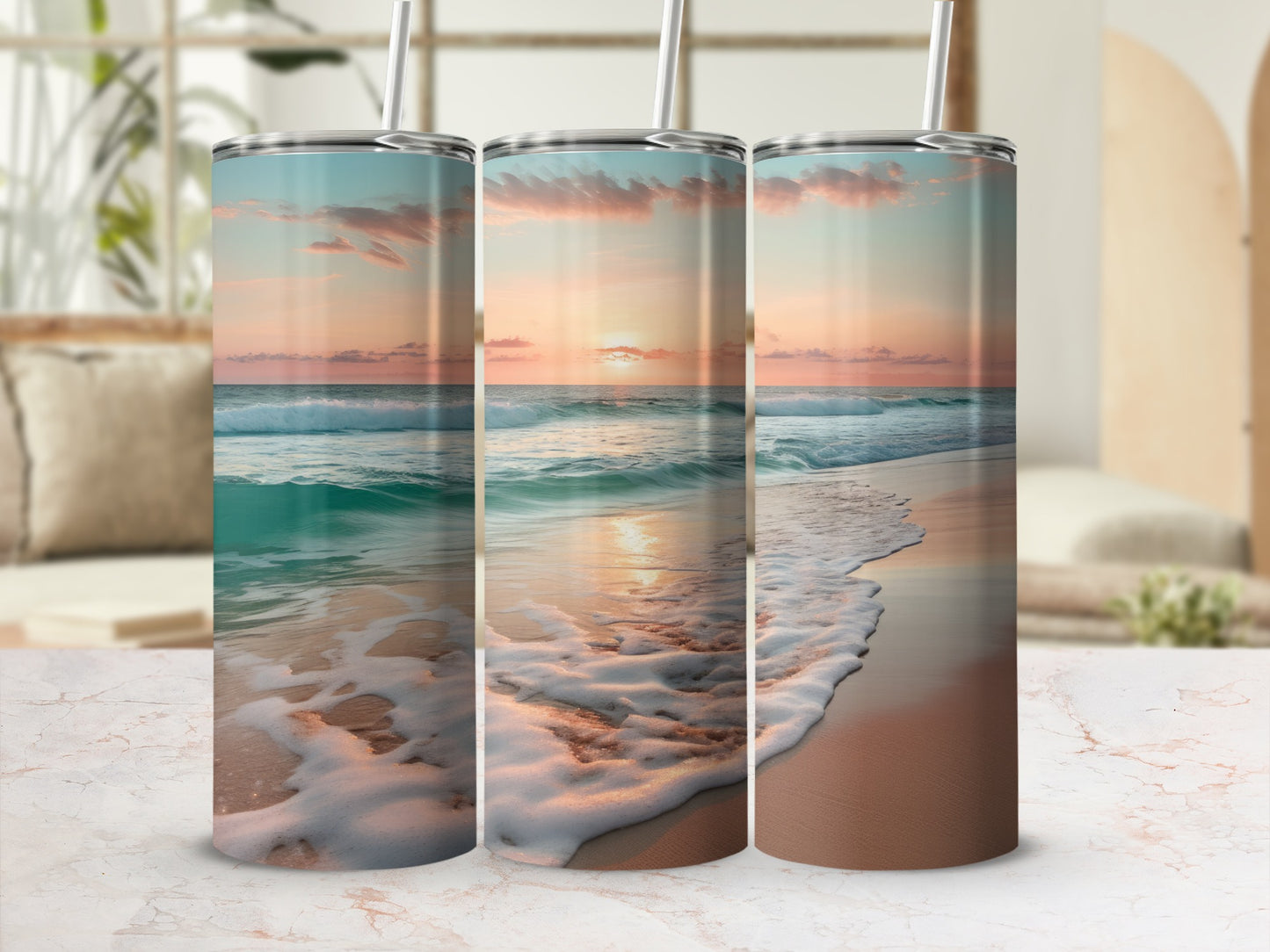Three tumblers featuring a sunset beach scene with ocean waves and clouds.