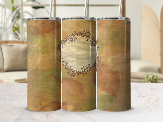 Three tumblers with a fall leaf design and a central circular emblem.