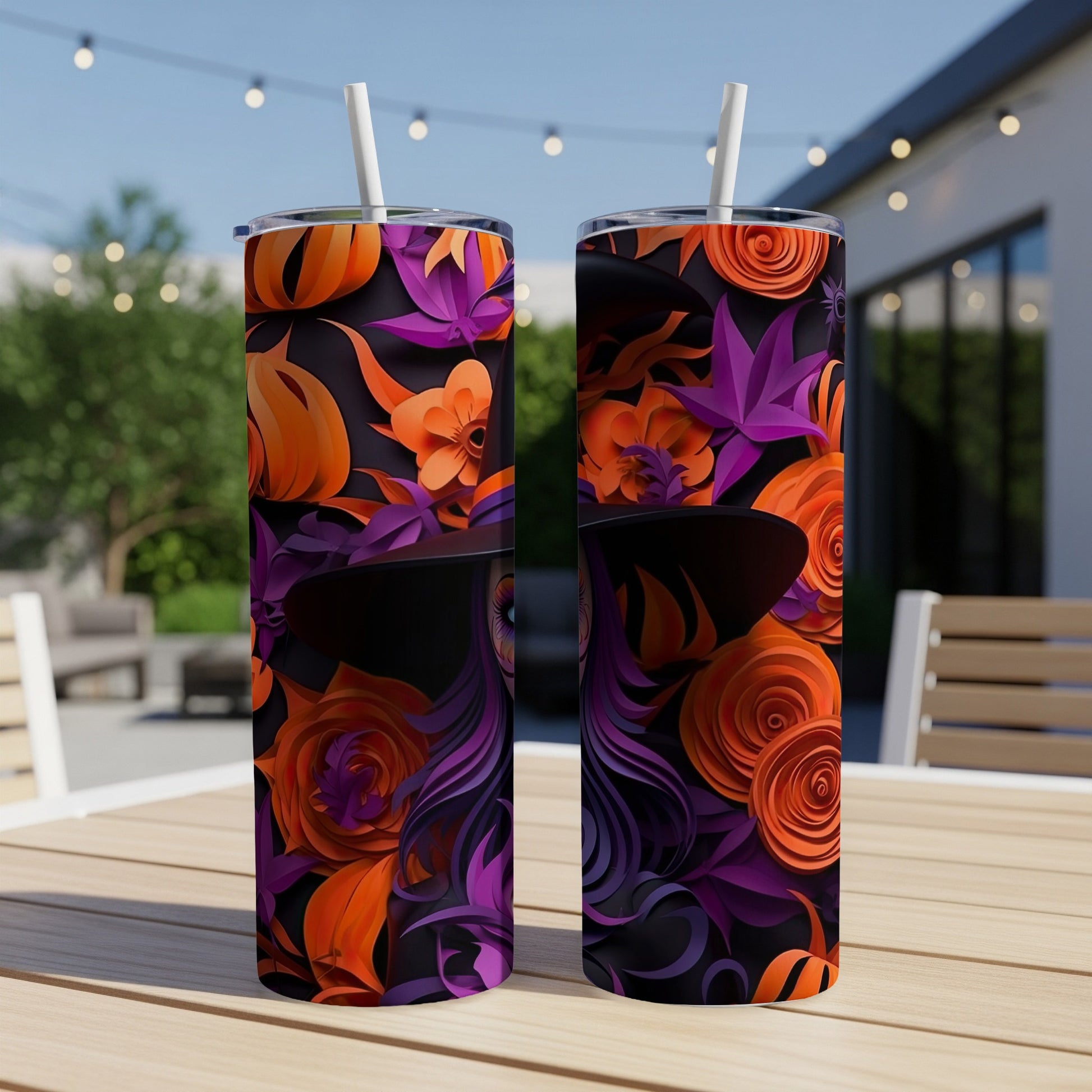 Two tumblers with a Halloween witch hat design featuring orange and purple paper flowers.