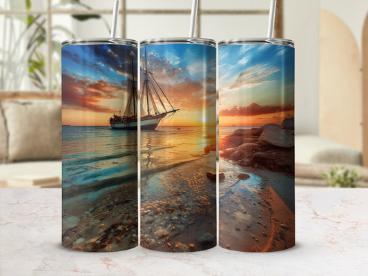 Three tumblers with sunset sailing scene and sandy beach design.