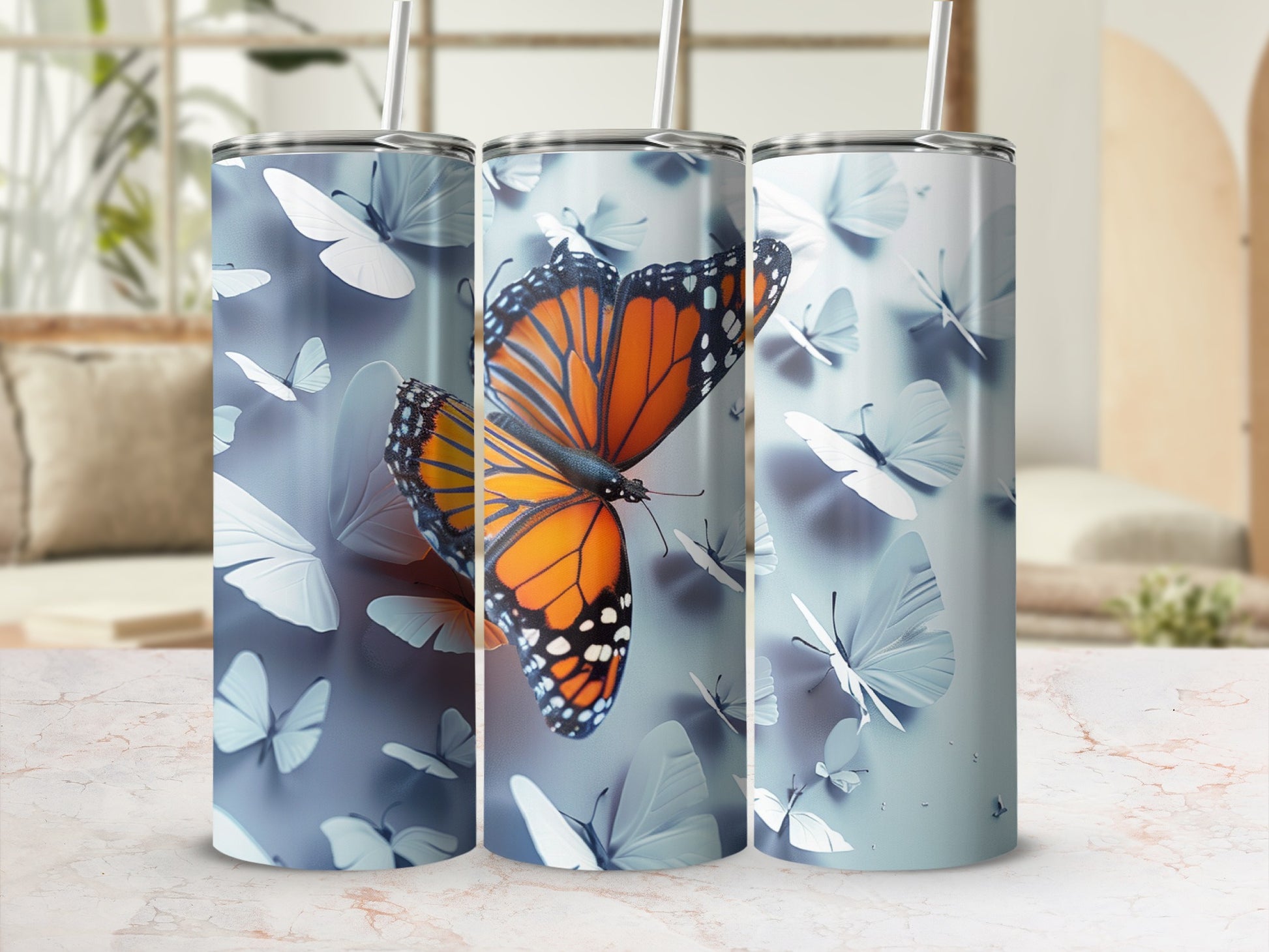 Orange and white monarch butterflies on a tumbler with light blue butterflies background.