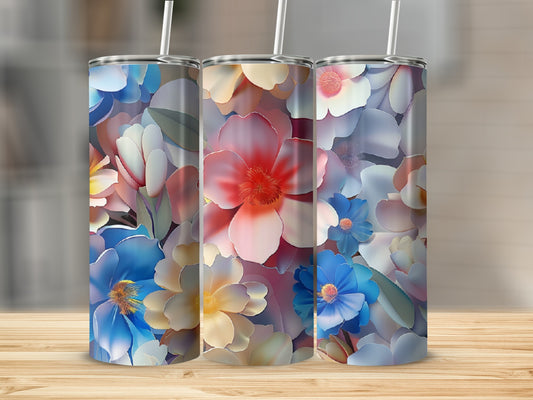 Three tumblers with a colorful floral pattern featuring blues, pinks, and whites.