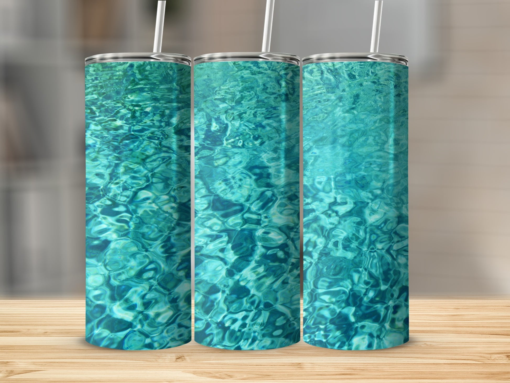 Three tumblers featuring a close-up of sparkling blue water.