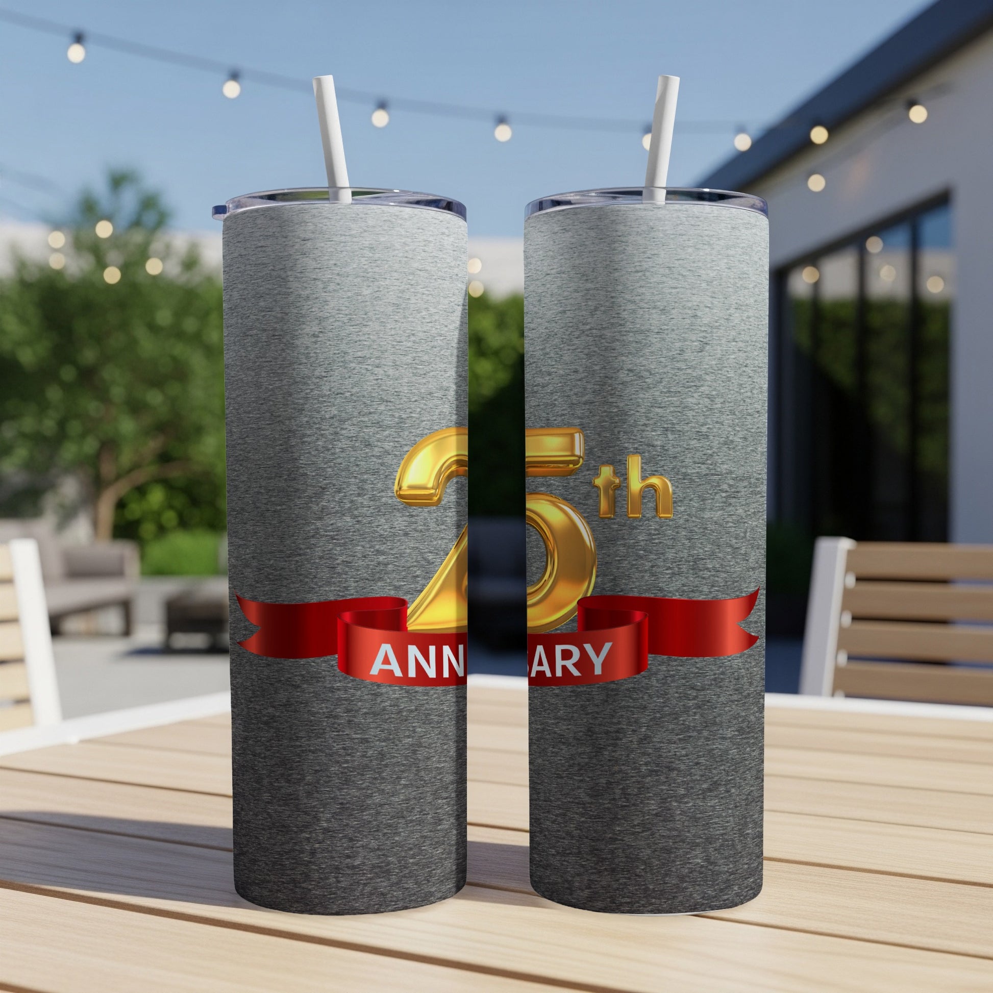 Two silver tumblers with "25th ANNIVERSARY" text on a ribbon.