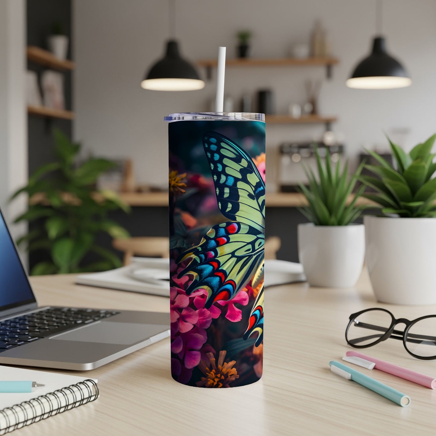 Tall tumbler with colorful butterfly and floral design.