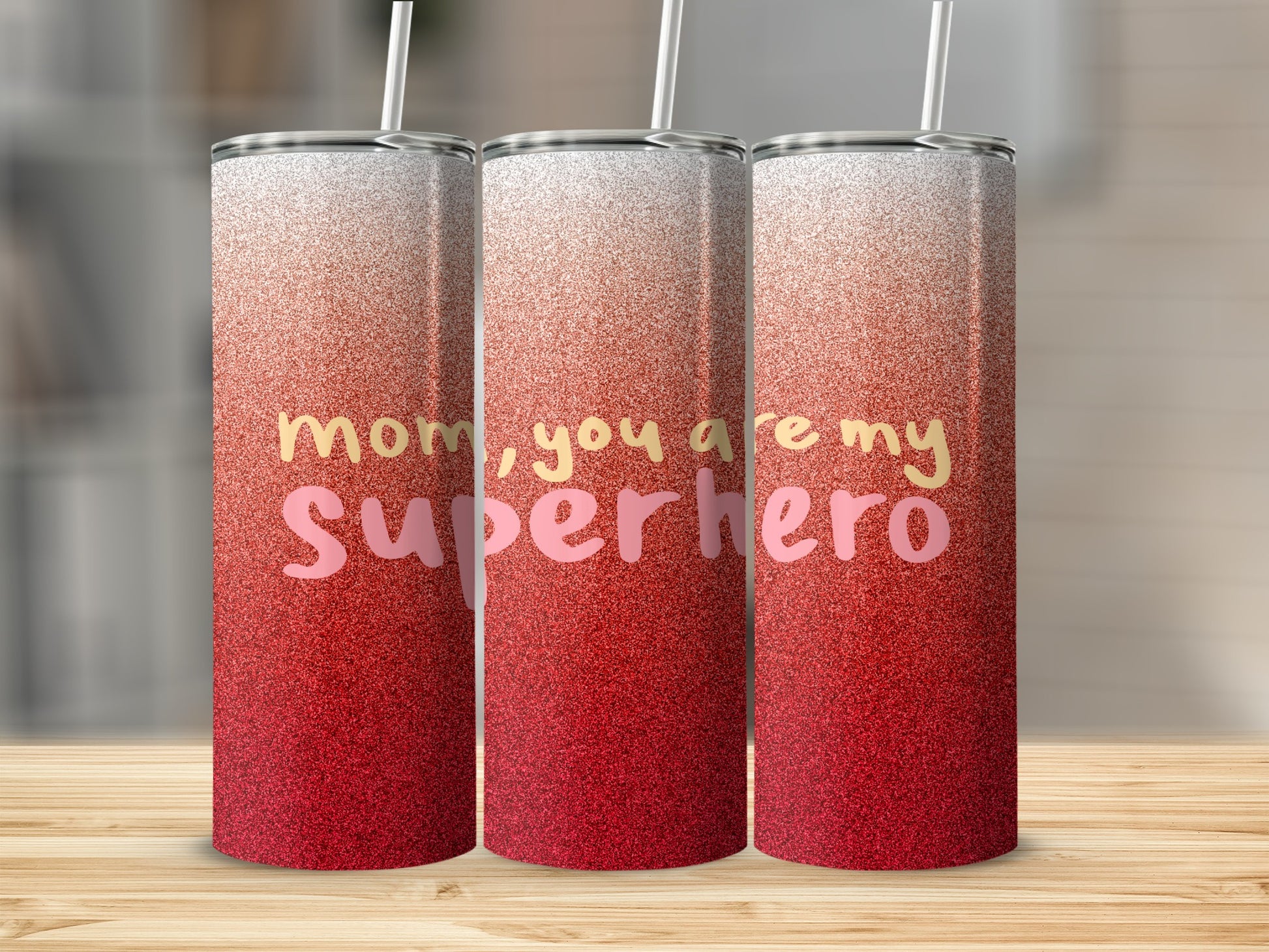 Three glitter tumblers with "mom, you are my superhero" text.