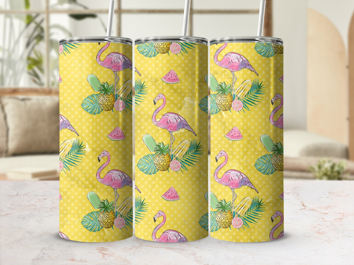 Three tumblers with pink flamingos, pineapples, and watermelon slices on a yellow background.