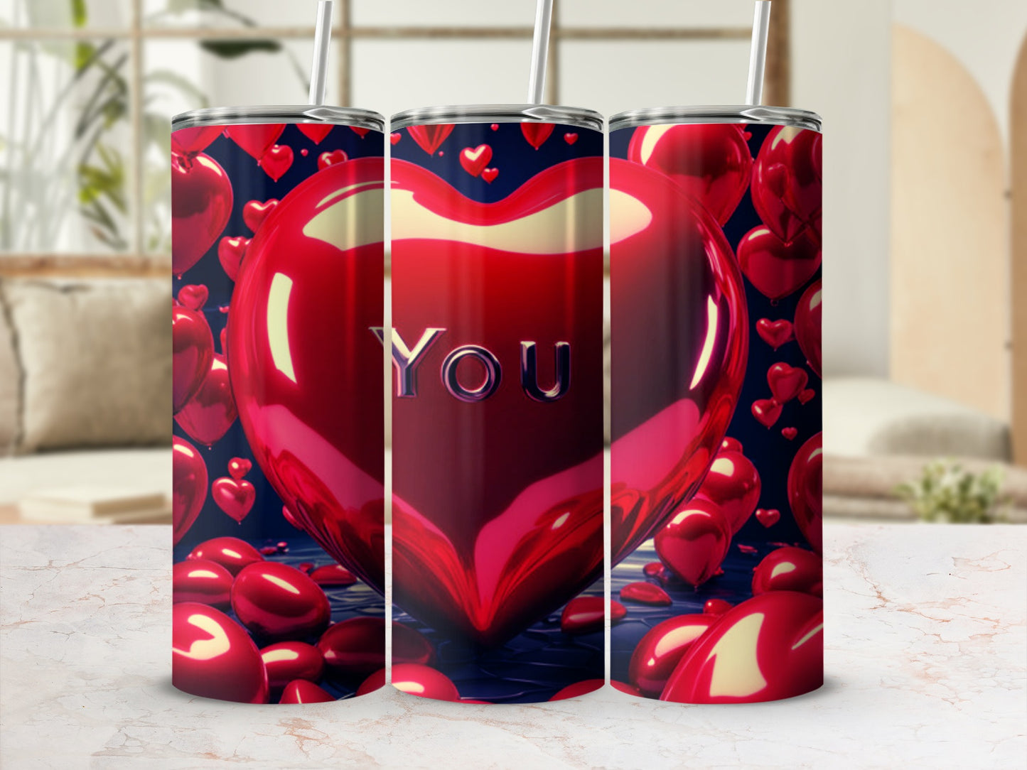 Three heart-shaped tumblers with "YOU" on the front tumbler.