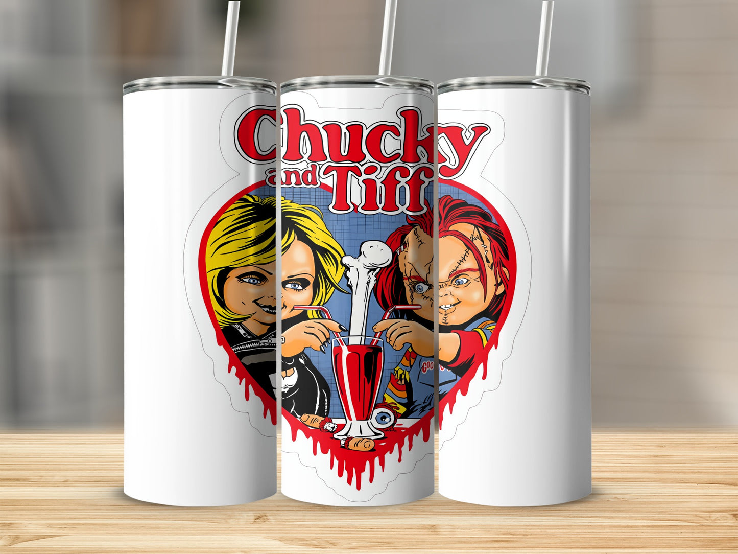 Chucky and Tiffany sharing a milkshake with bloody heart border on white tumblers.