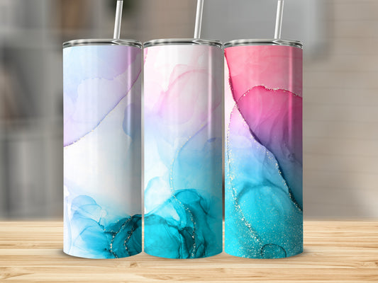 Three tumblers with abstract watercolor and glitter designs in pink, blue, and purple.