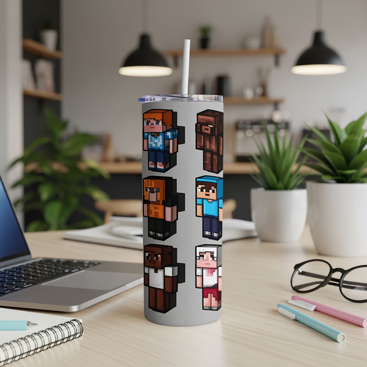 Pixelated characters with different skin tones and outfits on a silver tumbler.