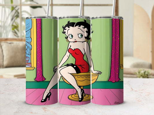 Betty Boop sitting in a gold chair, wearing a red dress.