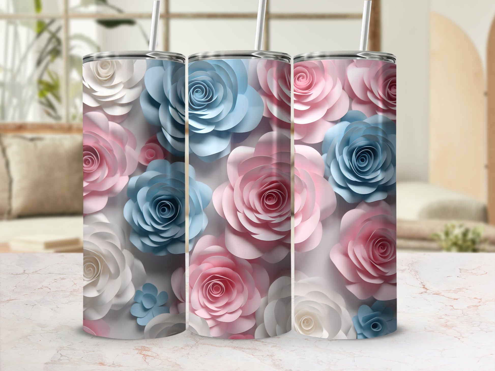 Three tumblers with pastel pink, blue, and white floral designs.