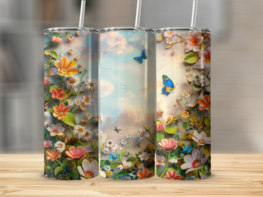Three tumblers with a floral and butterfly design against a sky background.