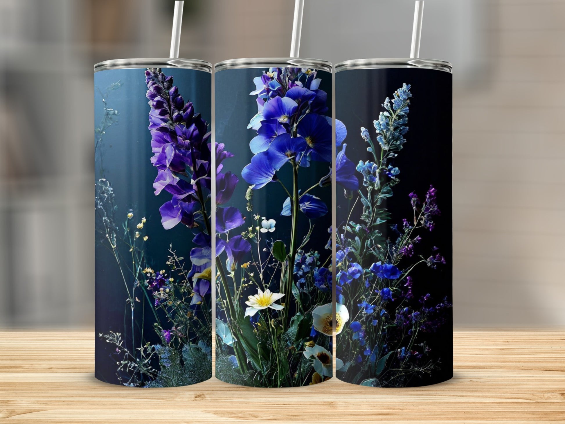 Three tumblers featuring a dark blue floral design with purple and white flowers.