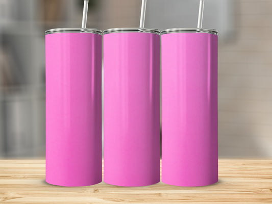 Three tall pink tumblers with straws stand on a wooden surface.