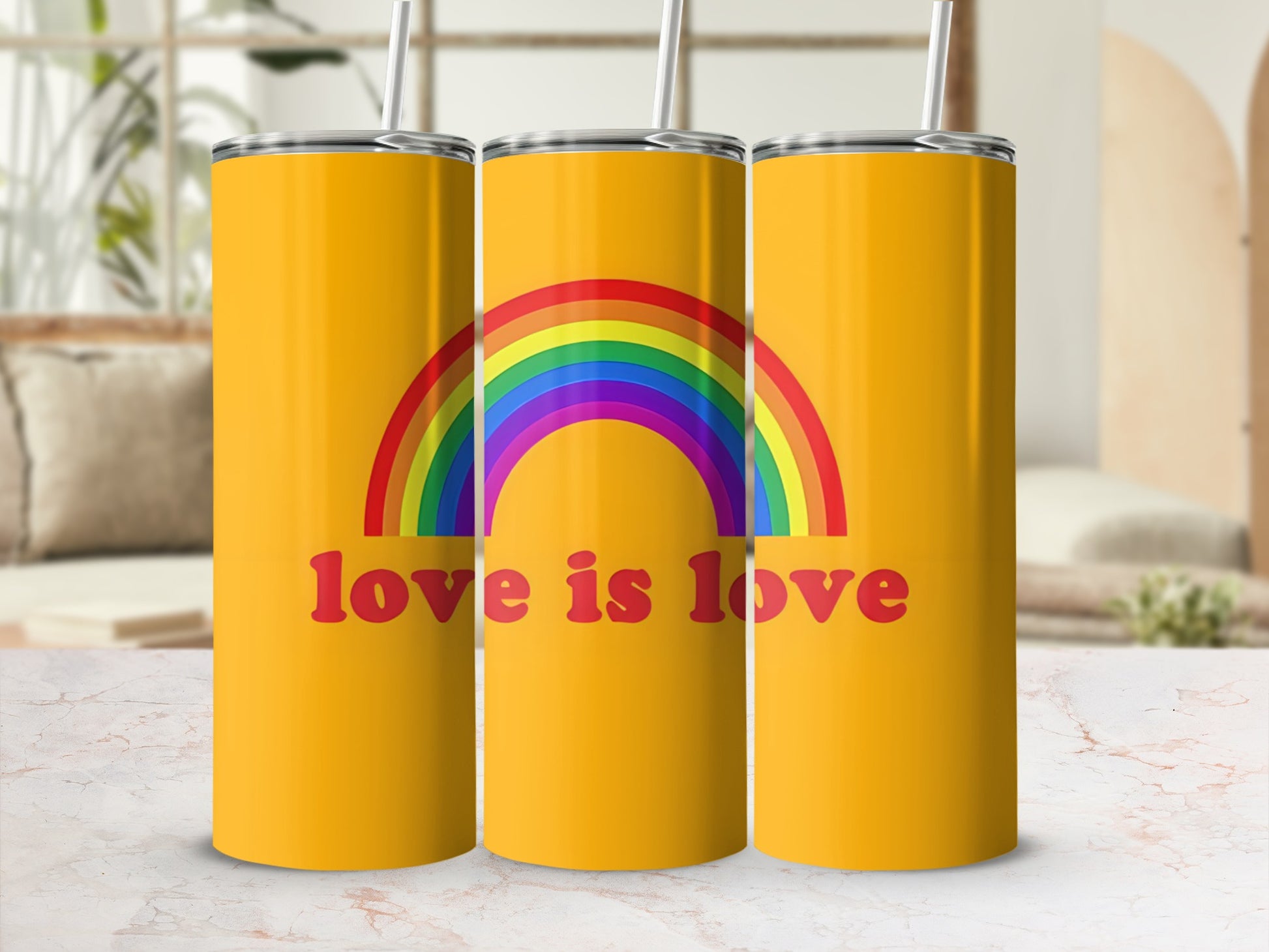 Three yellow tumblers with a rainbow and "love is love" text.