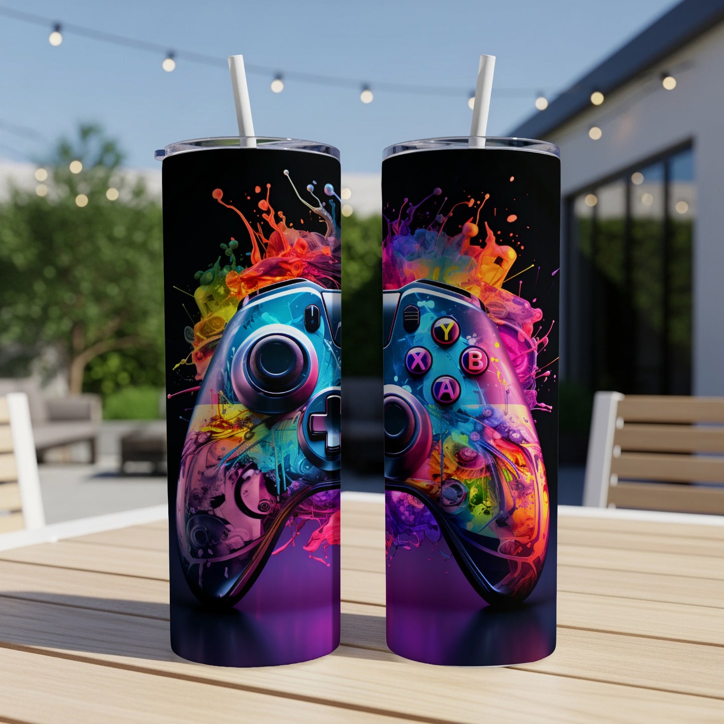 Two tumblers with colorful, abstract paint splatter designs featuring game controllers.