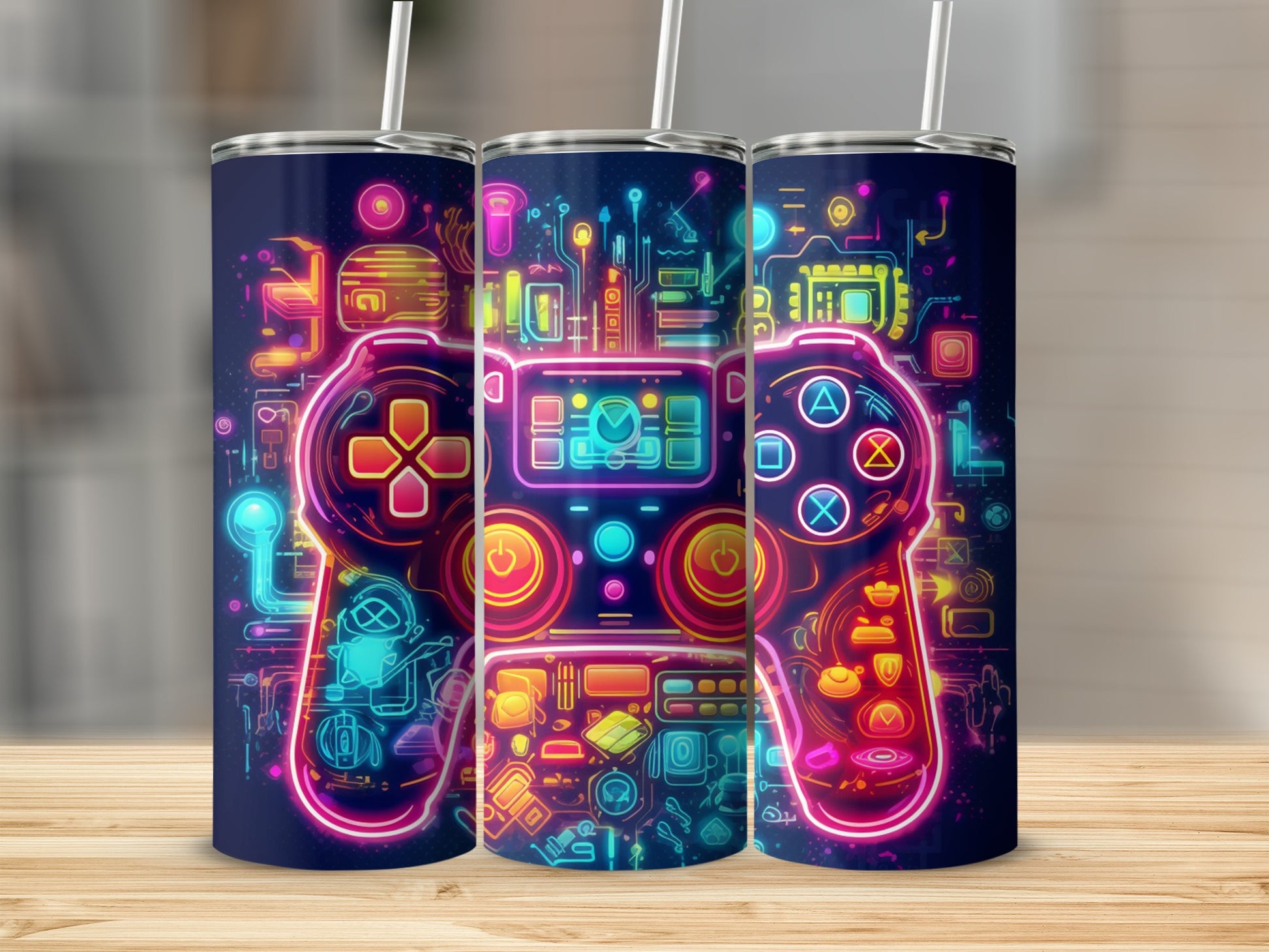 Three tumblers with neon cyberpunk gaming controller designs.