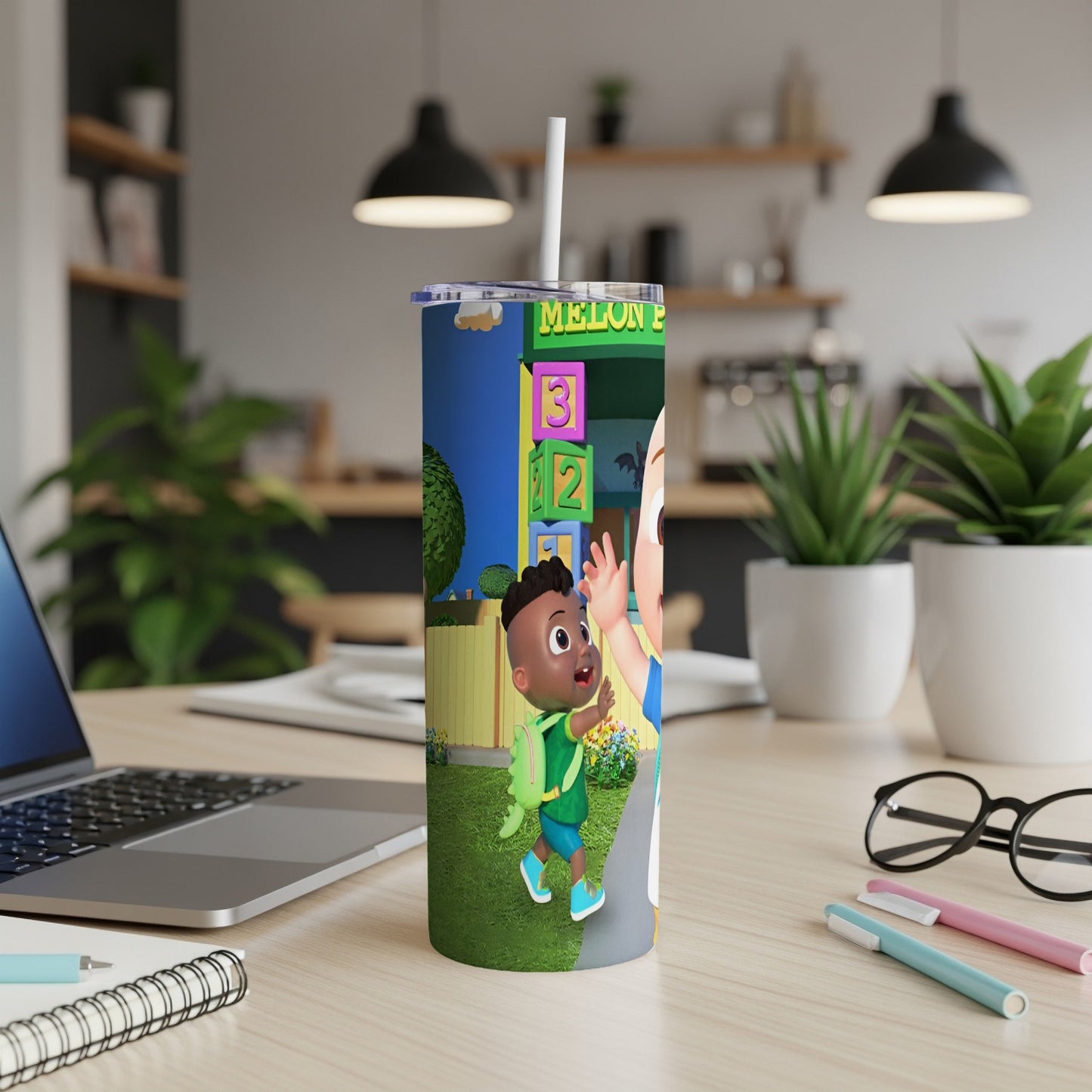 Cocomelon characters JJ and Cody on a colorful tumbler with a straw.