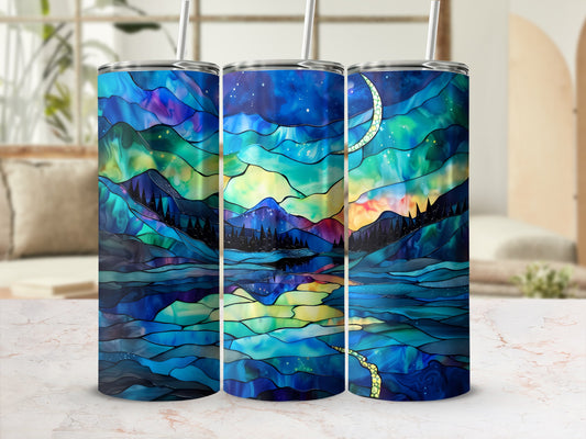 Stained glass style tumbler with a celestial landscape featuring a moon and mountains.