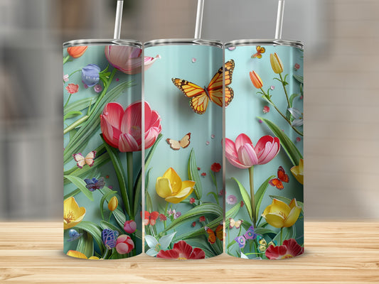 Three tumblers featuring a floral and butterfly design on a light blue background.
