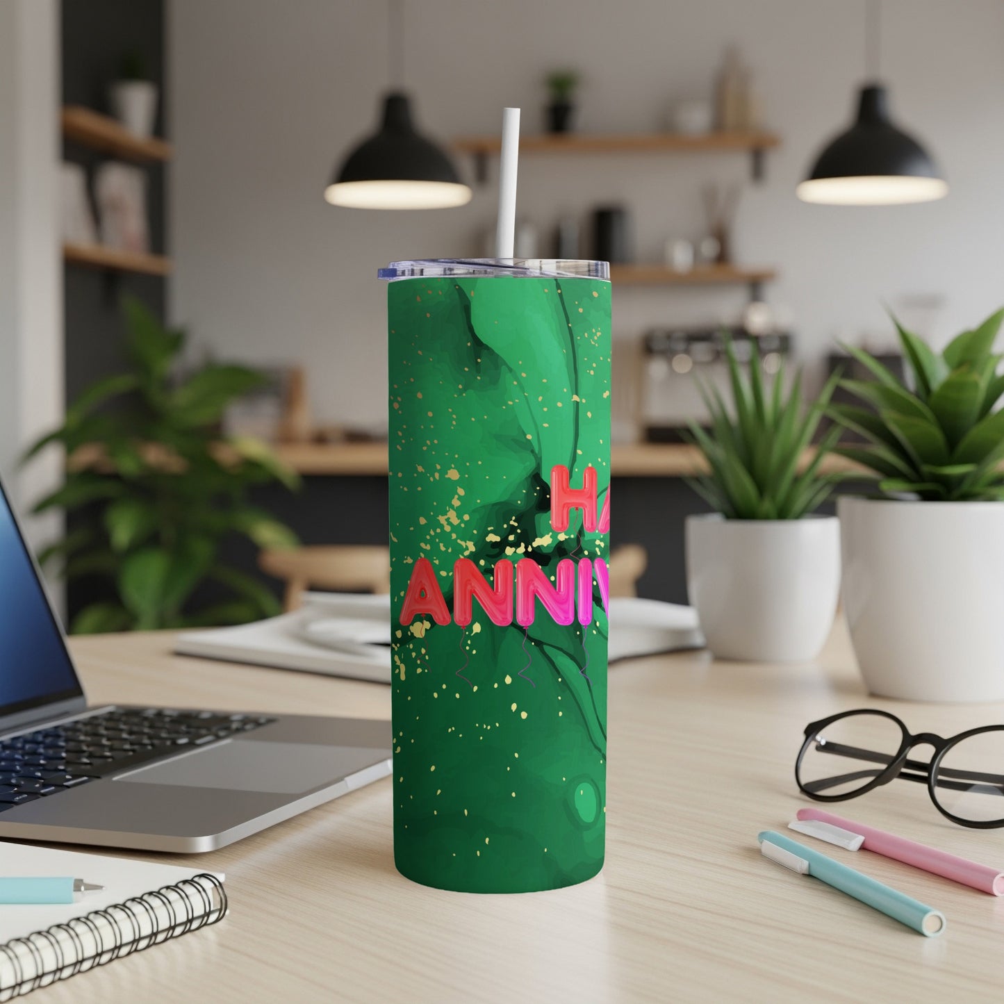 Green tumbler with pink "Happy Anniversary" text and gold splatter.