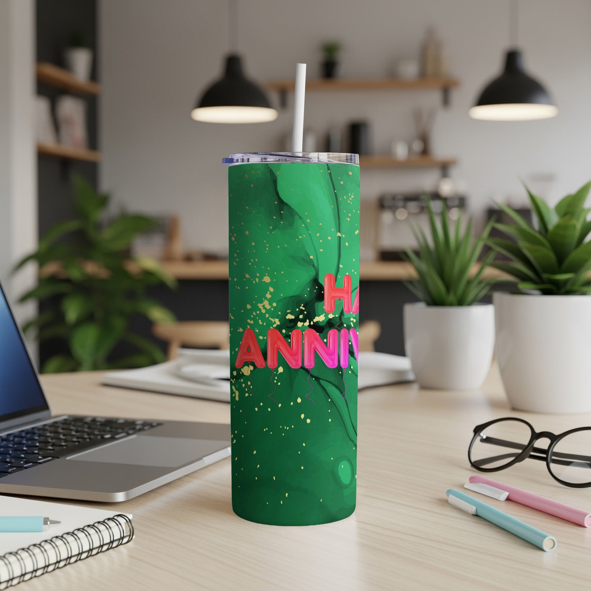 Green tumbler with pink "Happy Anniversary" text and gold splatter.