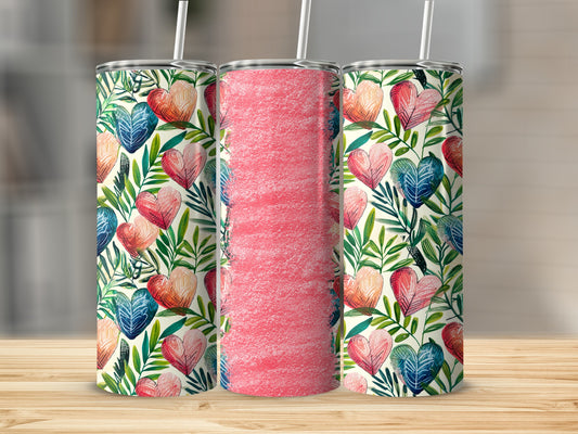 Three skinny tumblers with a heart and leaf pattern.