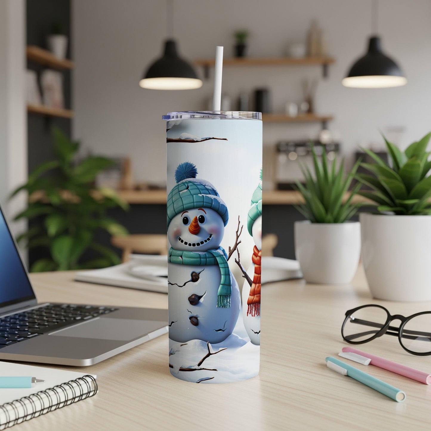 Two smiling snowmen with hats and scarves on a winter-themed tumbler.