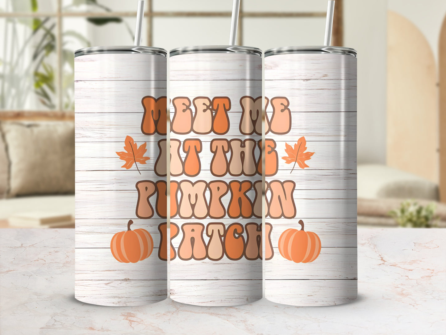 Tumbler with "Meet Me At The Pumpkin Patch" text and fall leaves.