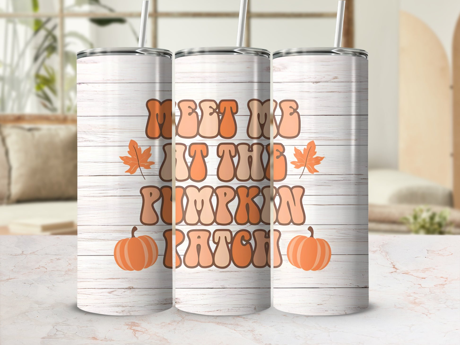 Tumbler with "Meet Me At The Pumpkin Patch" text and fall leaves.