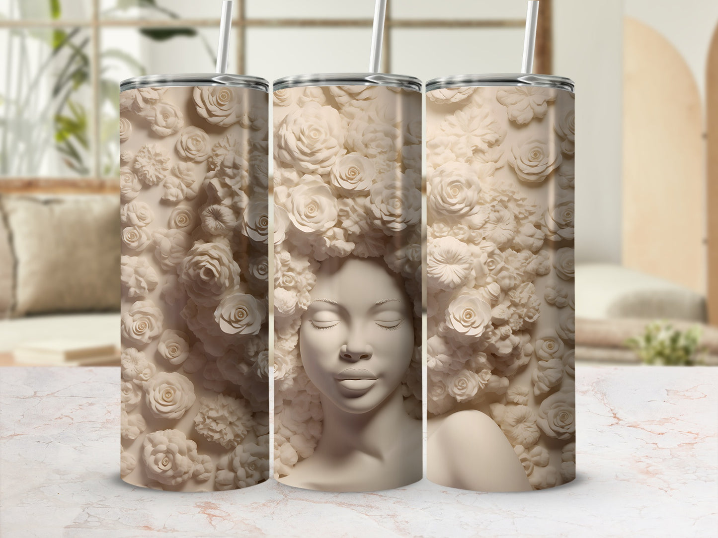 Three tumblers featuring a woman's face with floral accents.
