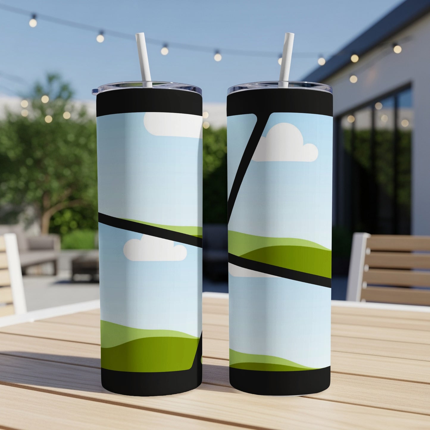 Two tumblers with a green hilly landscape and sky design.