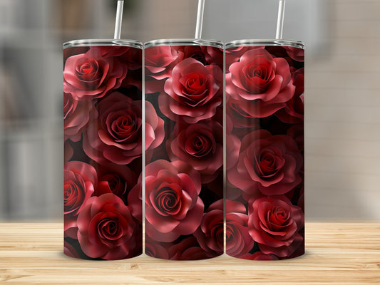Three tumblers with a repeating pattern of dark red roses on a wooden surface.