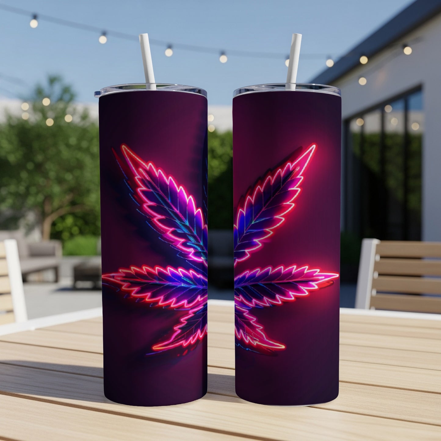 Two tumblers with glowing neon marijuana leaf designs.