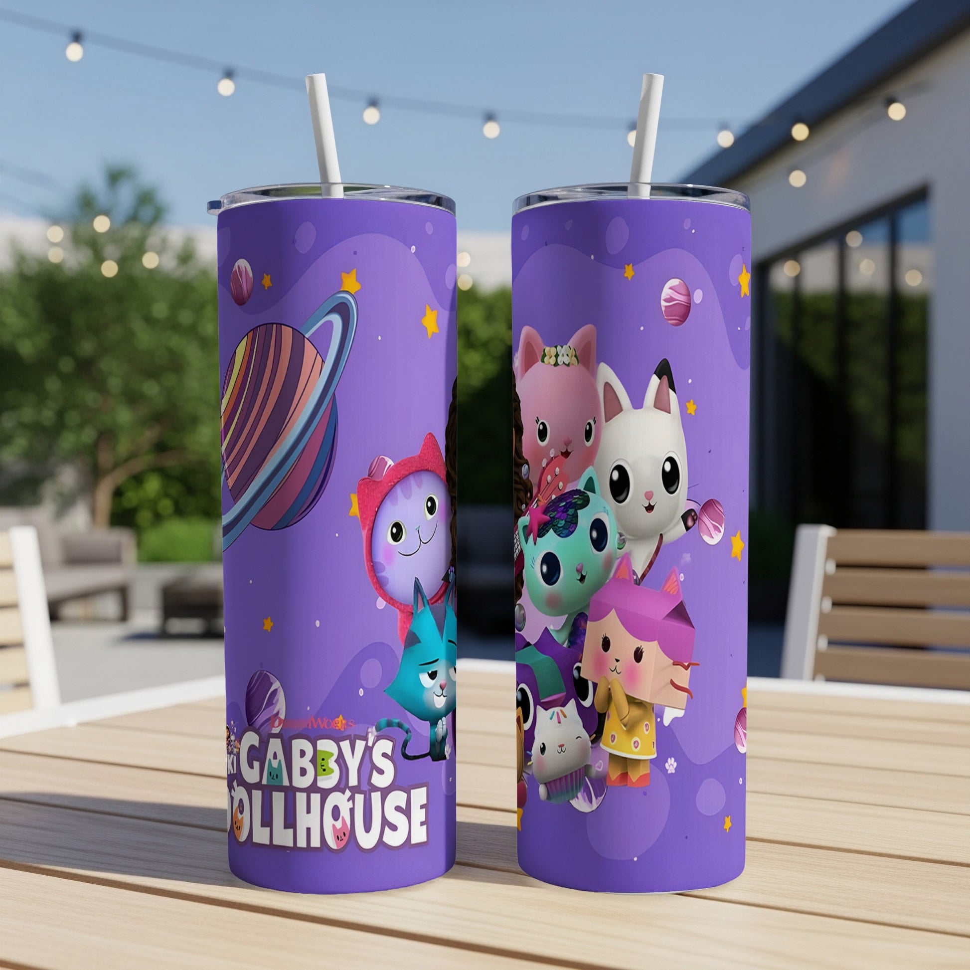 Gabby's Dollhouse tumbler with cartoon cat characters on a purple background.