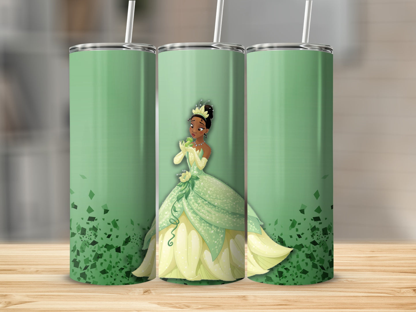 Green tumbler with Princess Tiana in a yellow dress on a light green background.
