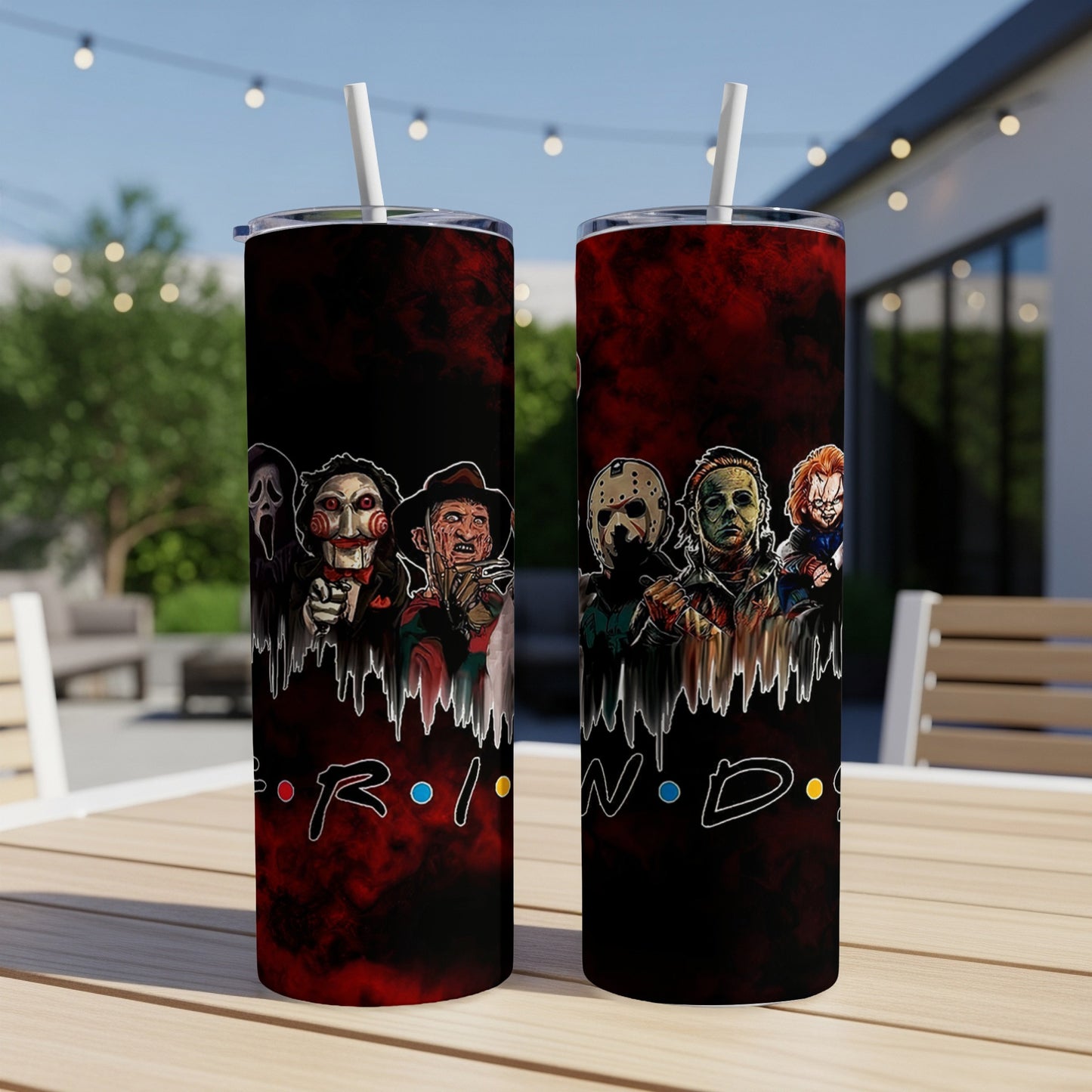 Tumbler featuring horror movie villains on a dark, bloody background.