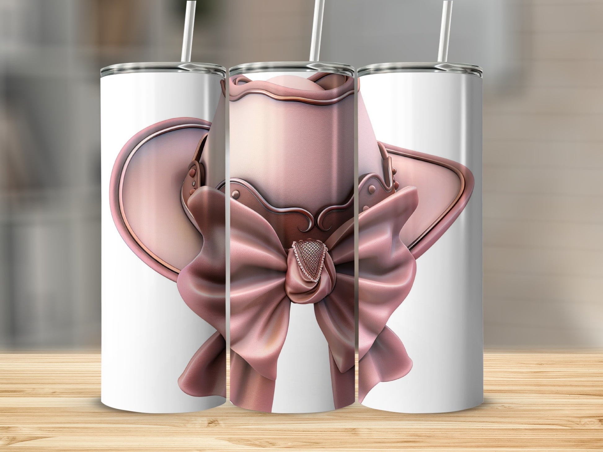 Pink cowboy hat with bow and embellishments on a tumbler.