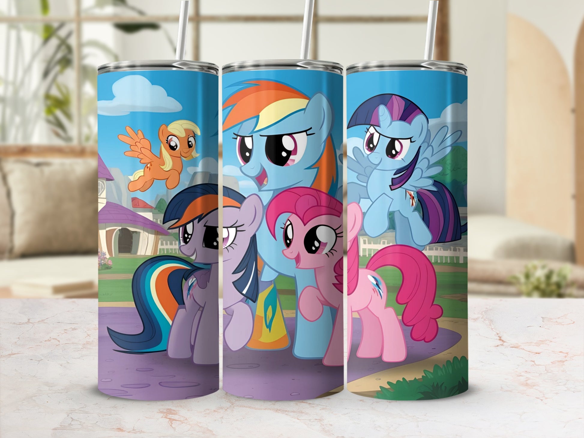 My Little Pony characters Rainbow Dash, Pinkie Pie, and Fluttershy on a blue tumbler.
