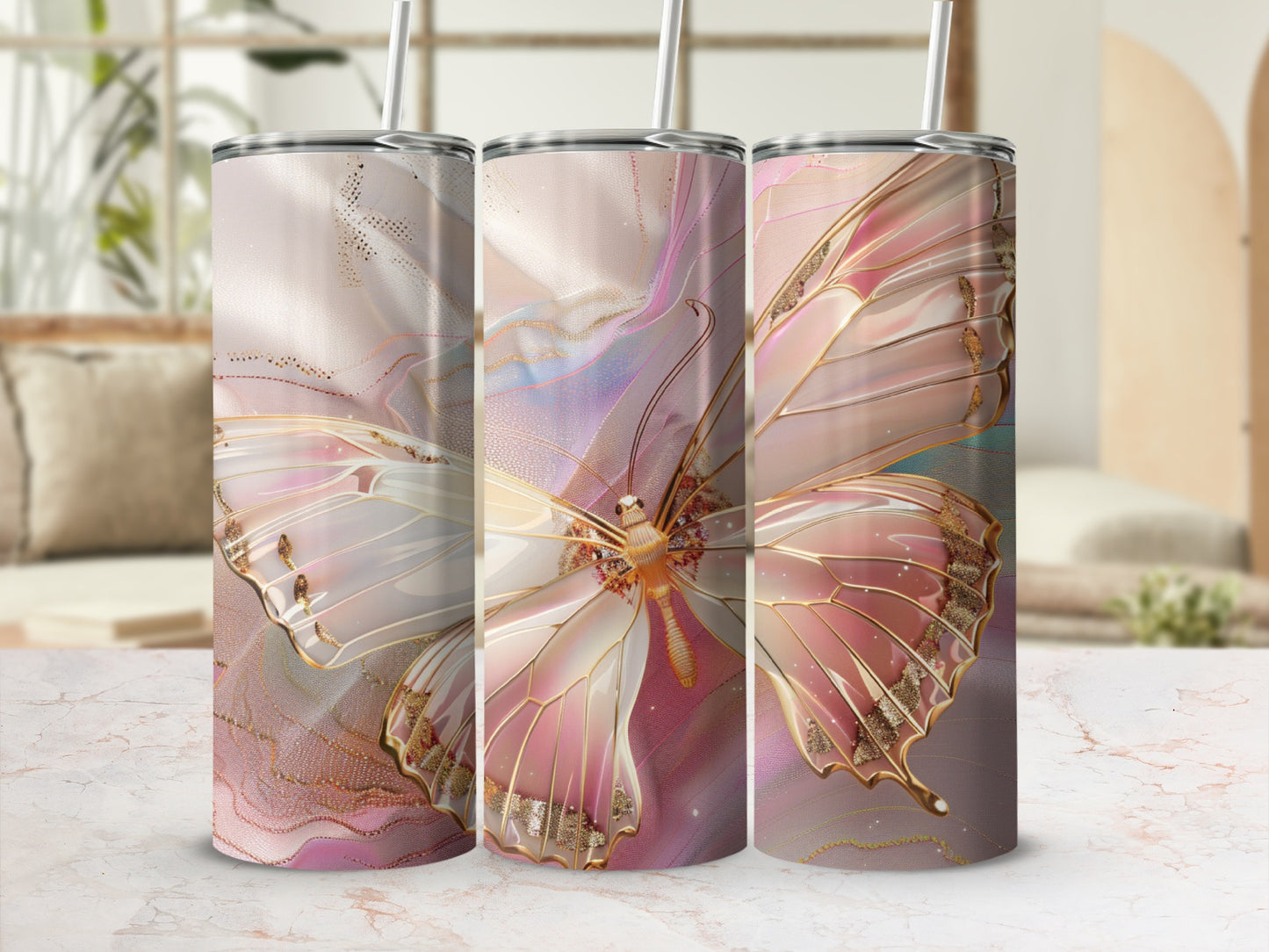 Three tumblers with iridescent butterfly wings and gold accents.