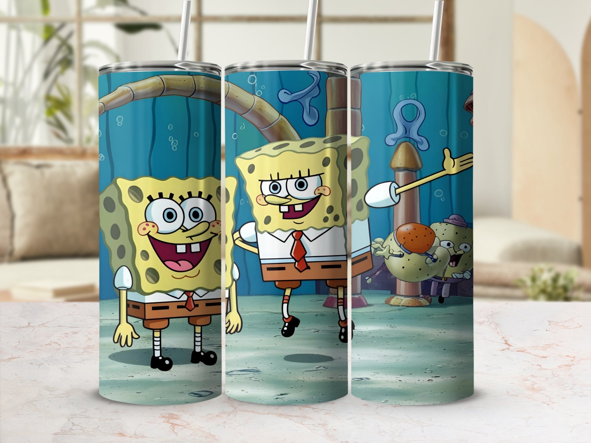 SpongeBob SquarePants characters on a blue tumbler with a white straw.