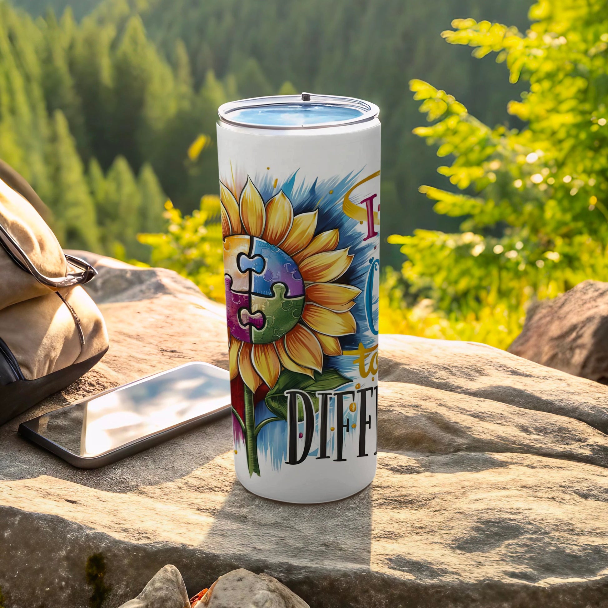 Tumbler with sunflower and puzzle pieces, "I turn my differences into DIFFerent" text.