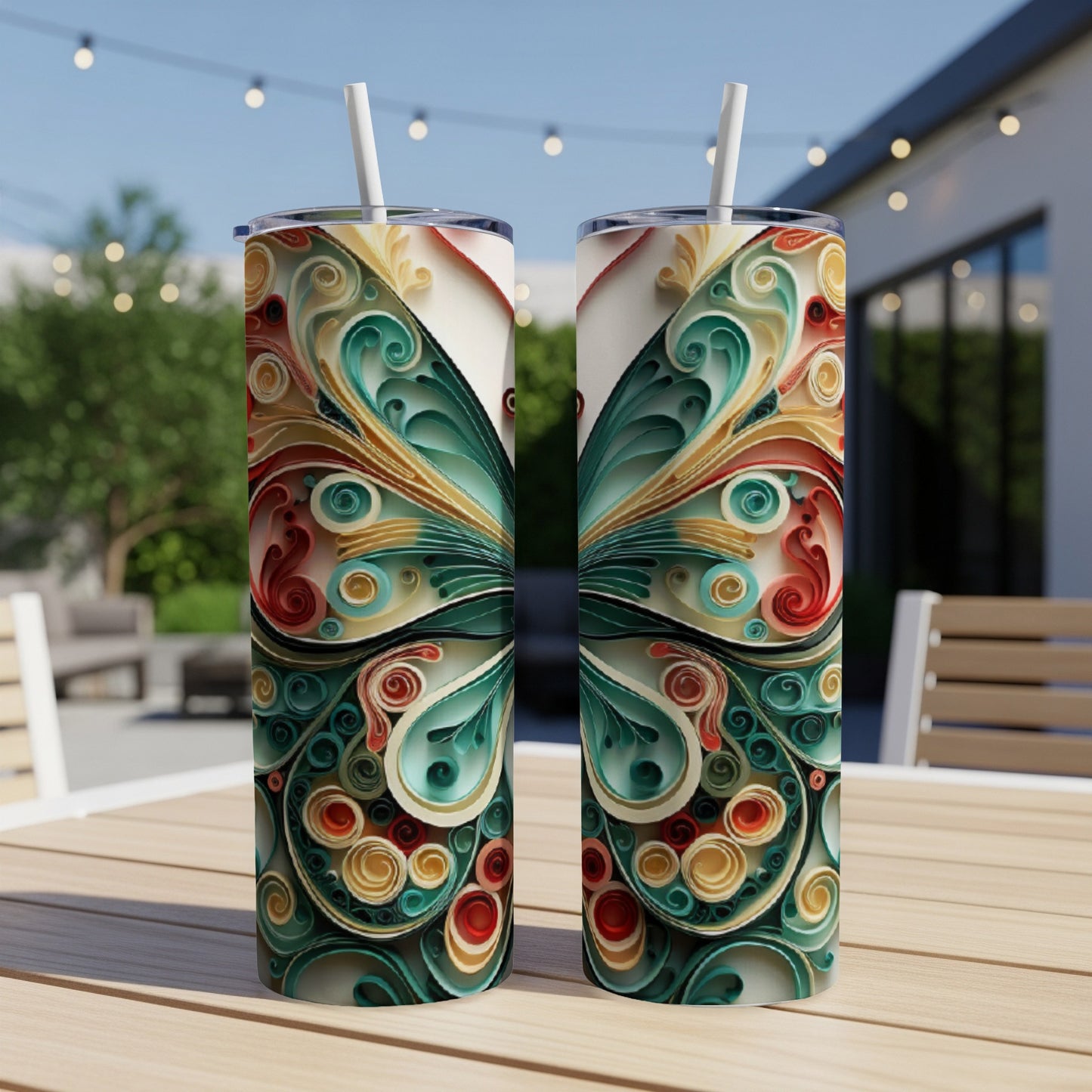 Two tall, slender tumblers with a colorful, intricate butterfly wing design.