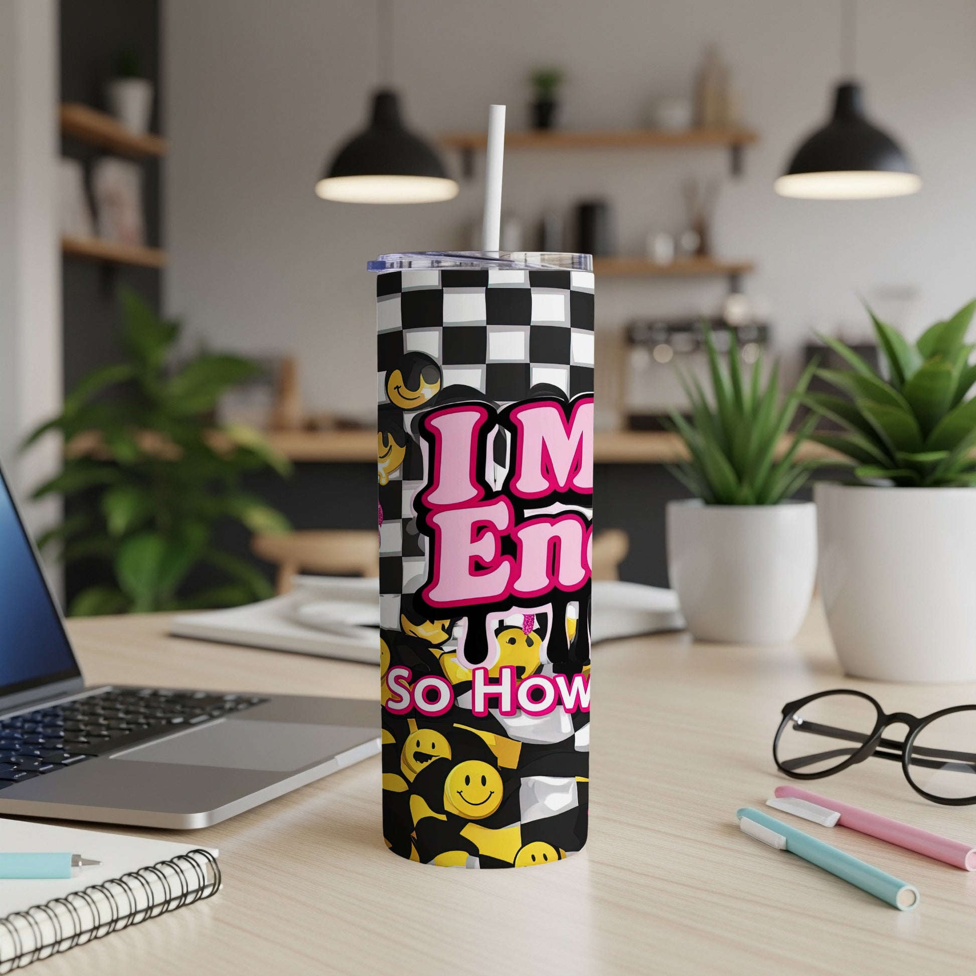 Checkered tumbler with smiley faces and "IM En so How" text.