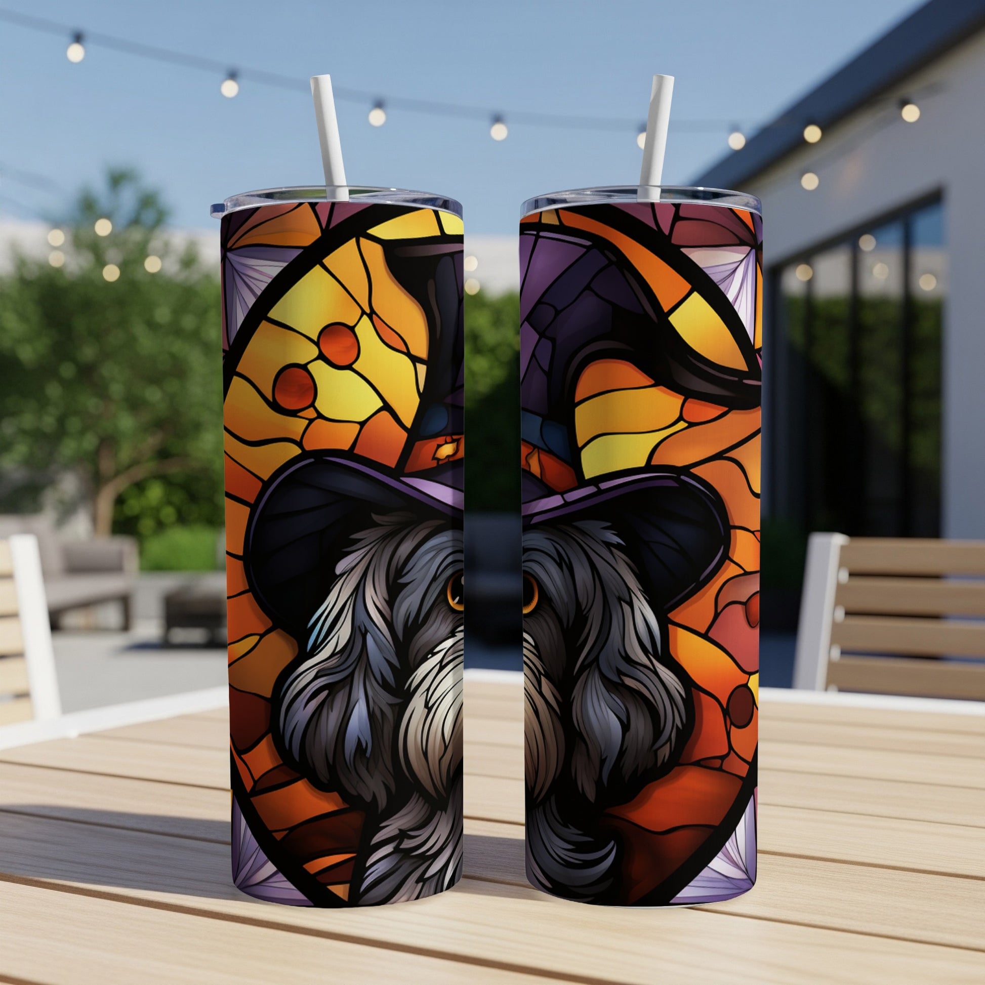 Black dog wearing a witch hat, stained glass design, on a tumbler.