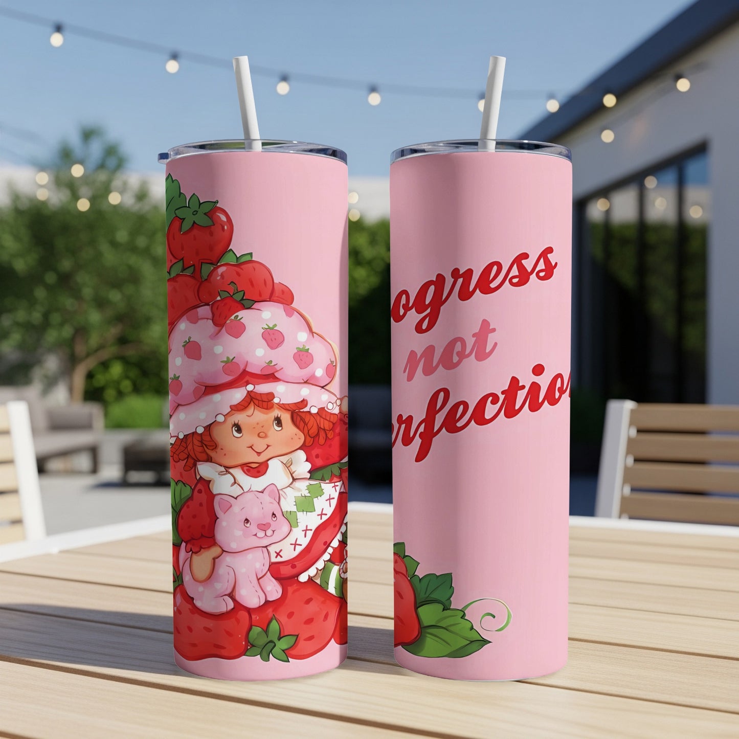 Pink tumbler featuring Strawberry Shortcake and the text "ogress not perfection".