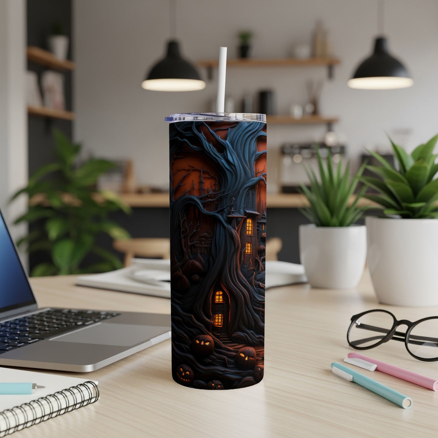 Tumbler with spooky haunted tree, jack-o'-lanterns, and lit windows design.