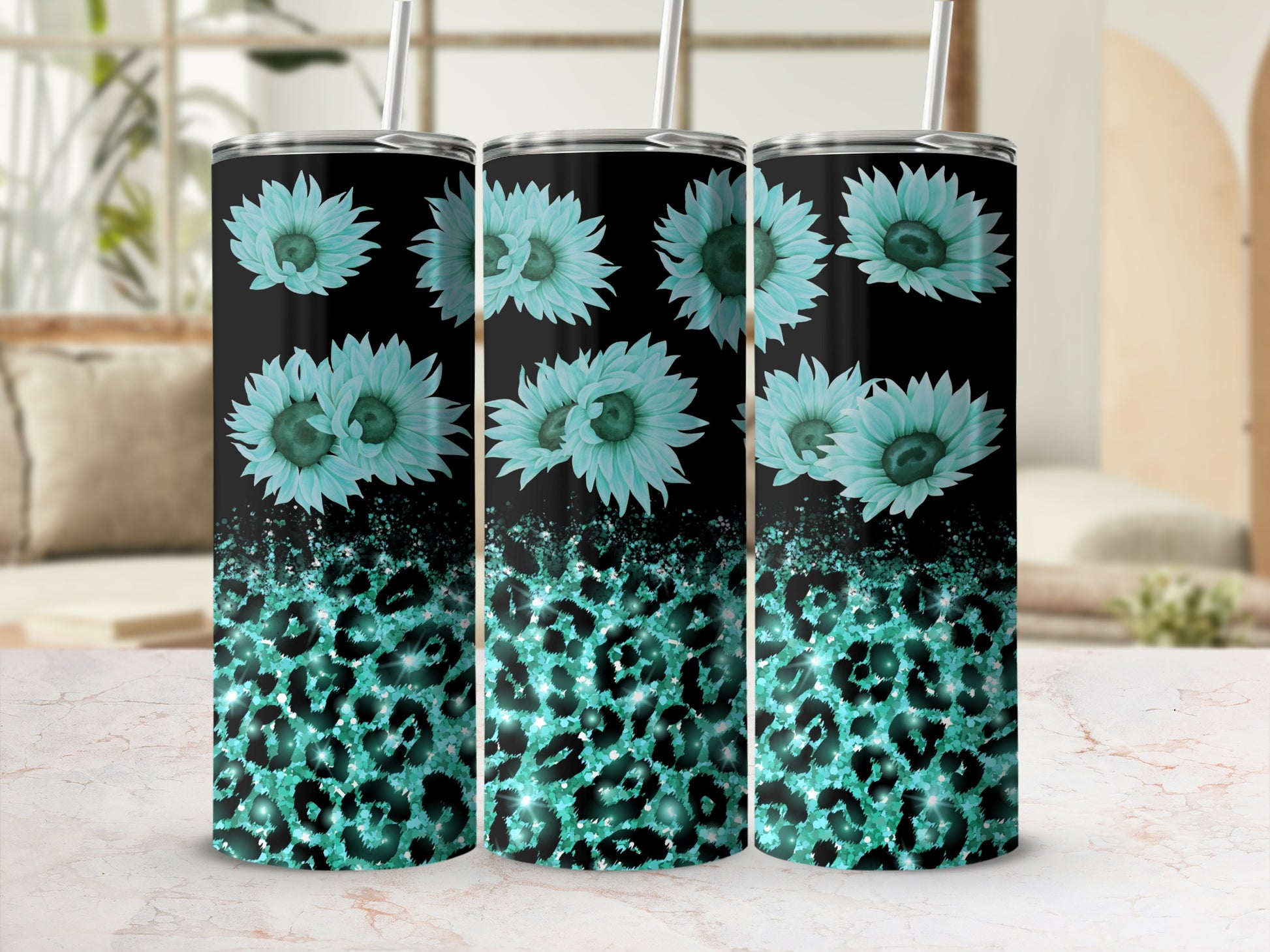 Turquoise sunflowers and glittery leopard print on black tumblers.